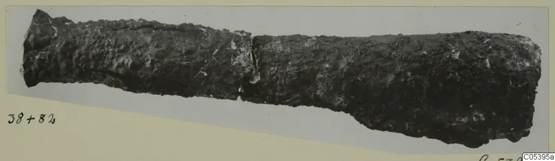 Corroded metal find from Amathus, a long tube-like object with a break near the middle