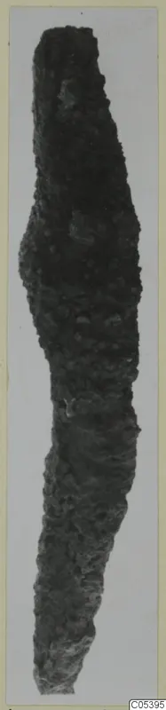 Heavily corroded iron tool from Amathus, long and tapering, with a bulge near the upper part.