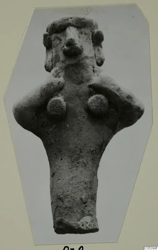 Terracotta figurine from Marion, Tomb 28: a standing figure with bent arms and hands near the breasts