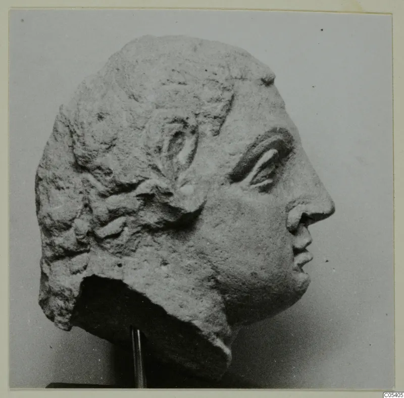 Head in profile facing right, from Mersinaki, with wavy hair and a broken lower edge