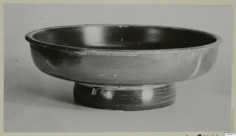 Black glazed bowl with a low ring foot, from the Marion tomb finds
