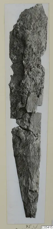 Long corroded metal object from Amathus, broken into several pieces and tapering to a point.