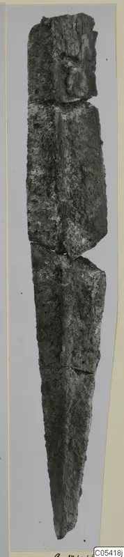 Corroded iron weapon from Amathus, shown upright against a grey background