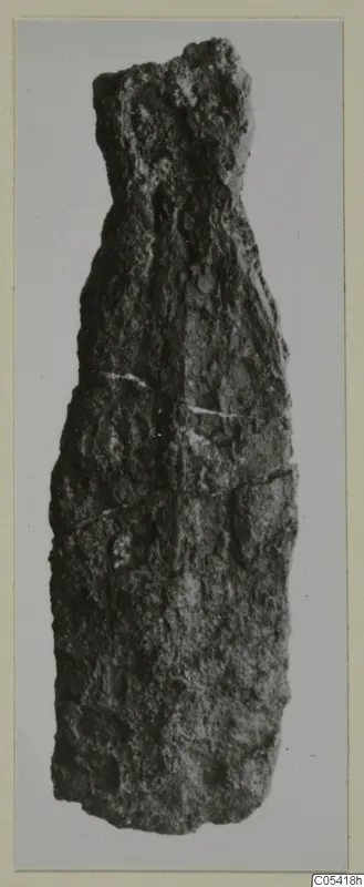 Corroded iron weapon fragment from Amathus, long and narrow with a narrower broken top end.