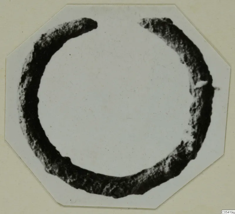 Bronze ring from Marion, incomplete, with a gap at the top where the two ends are broken off.