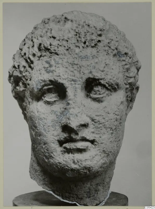 Stone head from Mersinaki with short curly hair and large heavy-lidded eyes