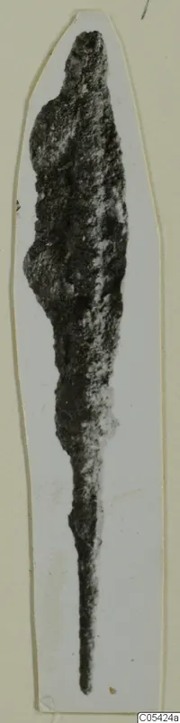Corroded iron weapon with a broad upper blade tapering to a long, thin tang