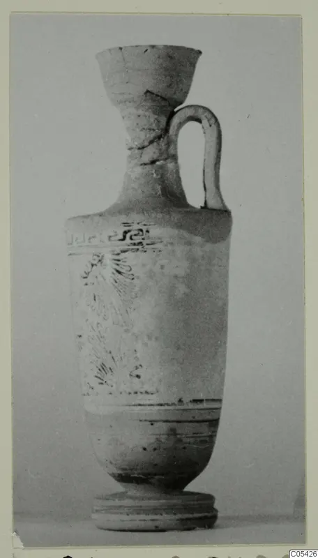 Lekythos in White Grounded Ware from Marion, tombs 31–45 series, shown against a plain grey backdrop