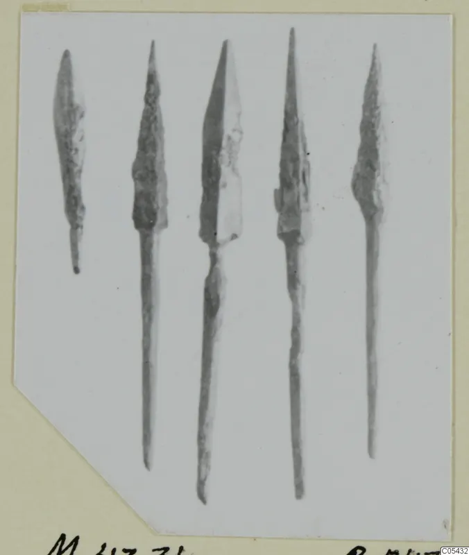 Five bronze arrowheads from Marion, tombs 31–45, shown in a row