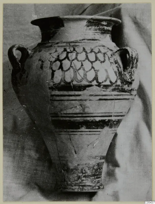 Two-handled jar with a flared rim, banded lower body and a row of pendent loops painted on the shoulder.