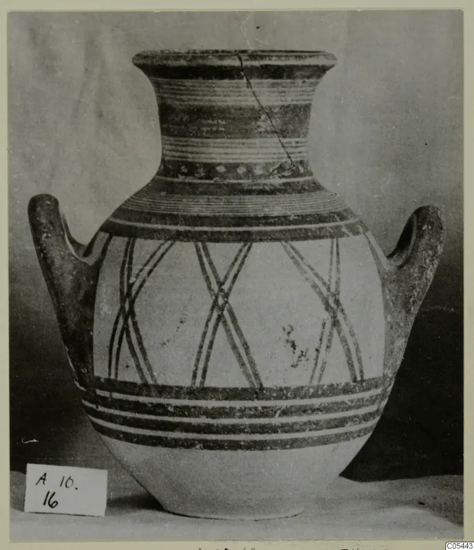 Two-handled pottery jar with painted bands on the neck and shoulder and crossed diagonal lines on the body