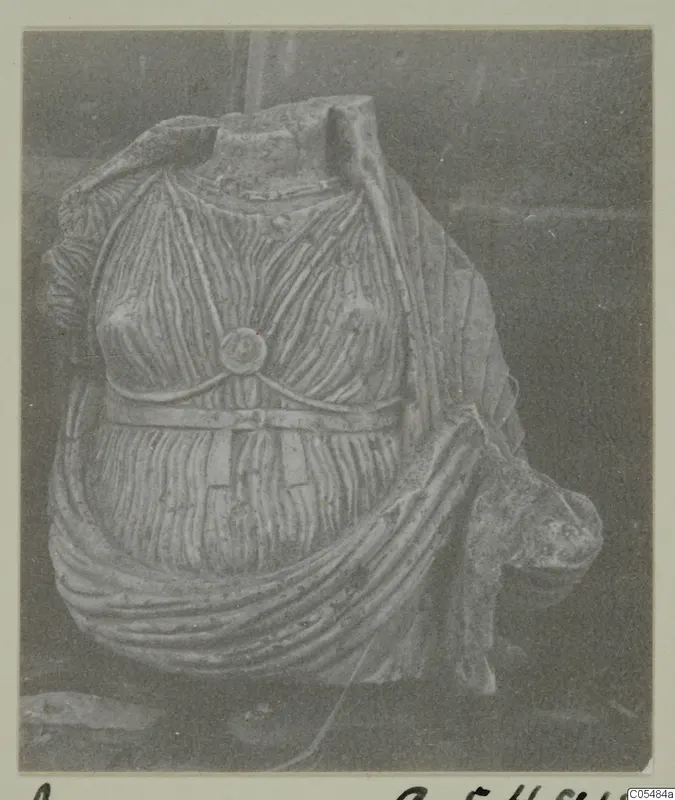 Stone statue fragment from Arsos: a headless torso with pleated drapery and a belt