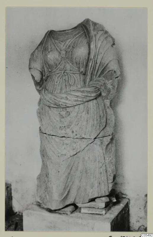 Draped stone statue from Arsos, headless with broken arms