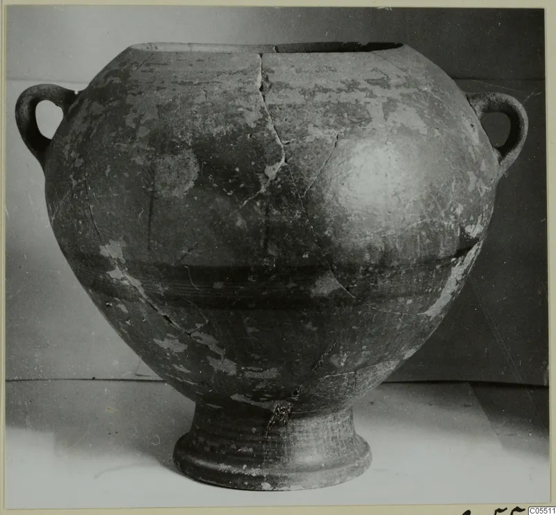 Two-handled pottery jar from Amathus with a dark painted band around the body