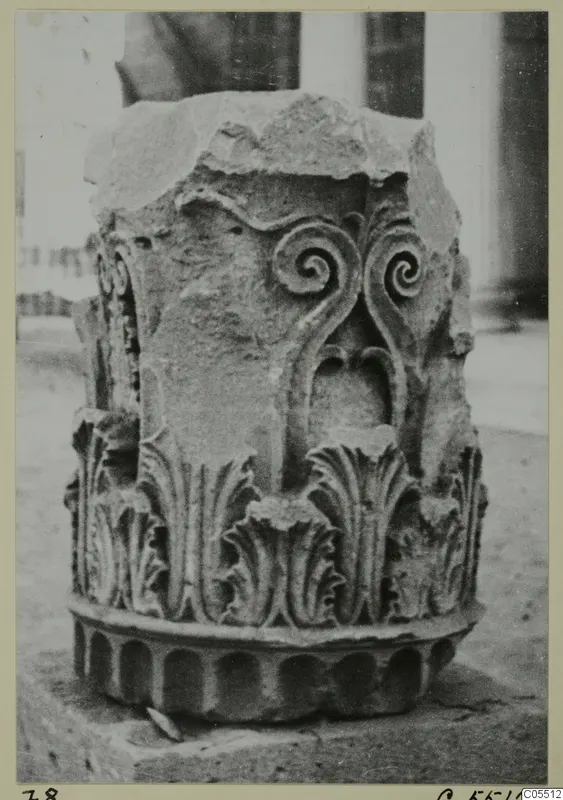 Carved stone capital fragment from Amathus, with spiral scrolls above rows of carved leaves