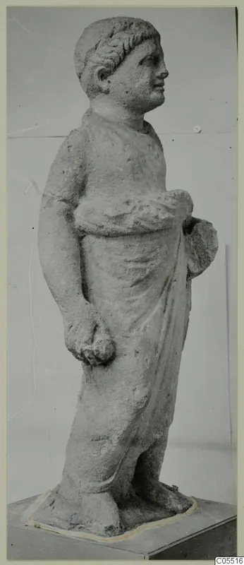 Standing limestone statue of a young figure in a draped garment, from Mersinaki, photographed on a plinth