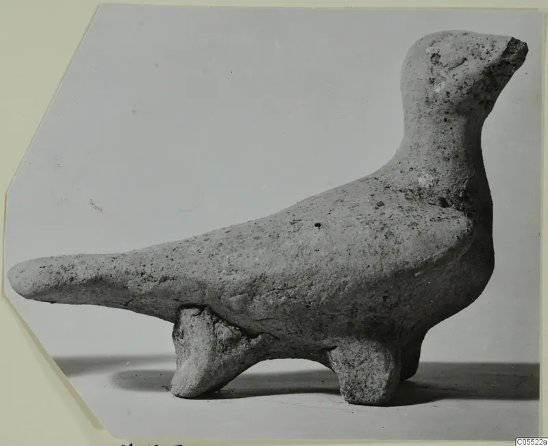 Terracotta figurine of an animal from Marion, shown in profile with a long tapering projection and raised head