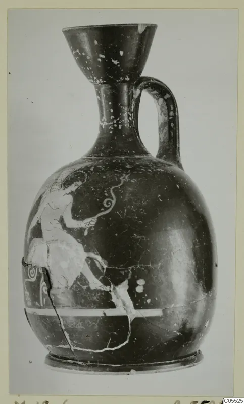 Pottery jug from Marion with a painted figure on its rounded body, photographed upright on a card mount