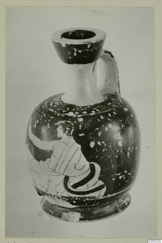 Jug with a rounded body and strap handle, with a figure painted in profile on its side