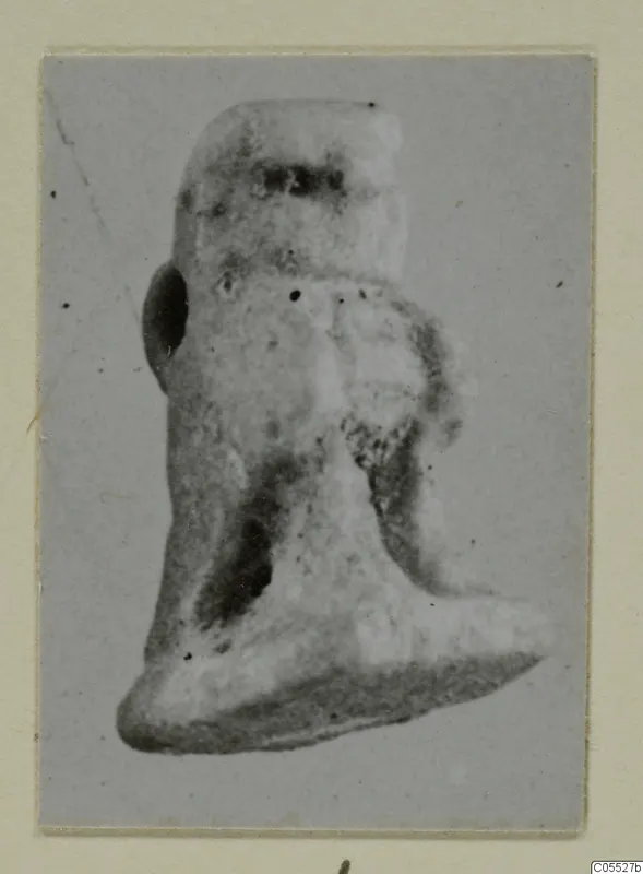 Small figurine from Amathus, shown in a photograph mounted on grey card