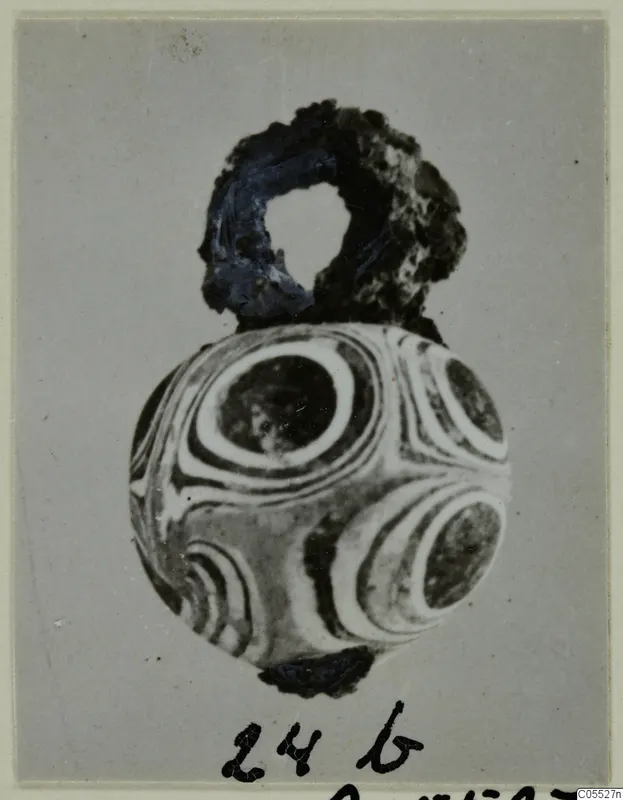 Round bead with concentric ring pattern and a loop at the top, from Marion Tomb 92