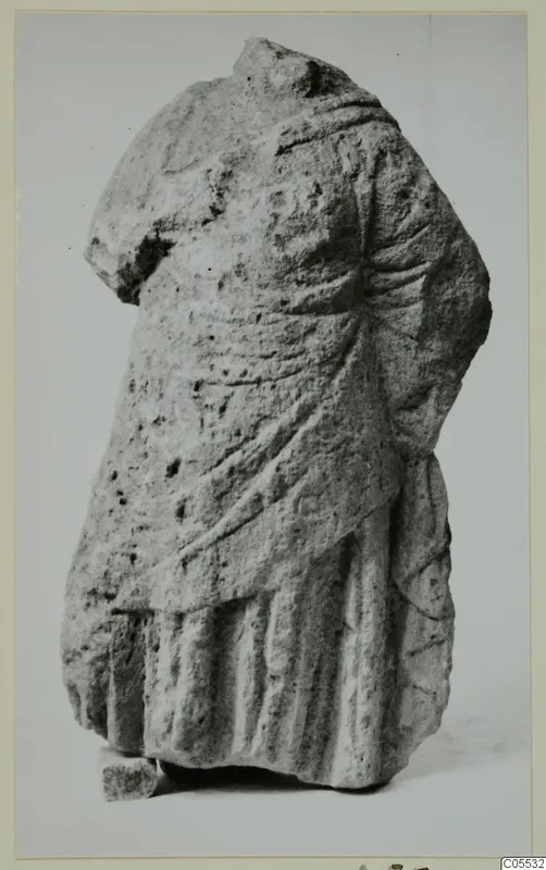 Headless draped statue torso from Mersinaki, carved in stone.