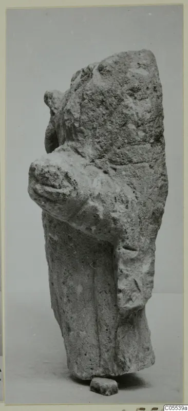 Limestone sculpture fragment of a figure from Mersinaki, with a bent arm and a small base