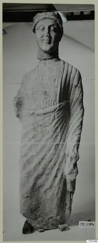Limestone statue of a standing figure in a long draped garment, from Mersinaki