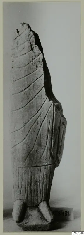 Limestone sculpture fragment from Mersinaki, a standing figure with broken top and incised drapery lines