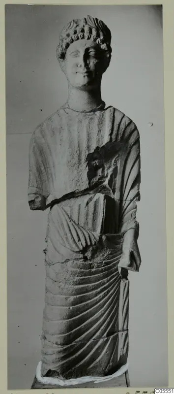 Limestone statue of a standing draped figure with a curled headdress, from Mersinaki
