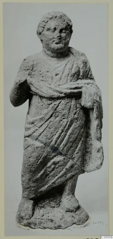 Standing draped statue from Mersinaki, with one arm bent at the chest, photographed against a grey backdrop