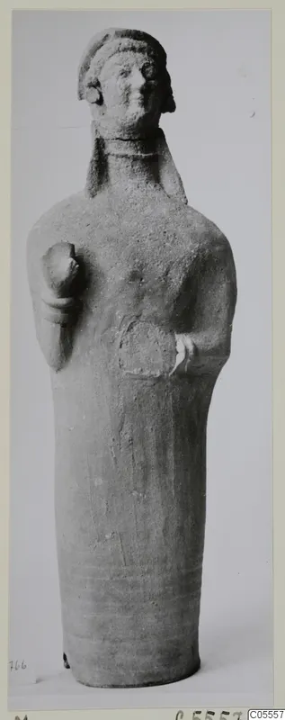 Terracotta standing figure from Mersinaki with a close-fitting headdress and cylindrical body