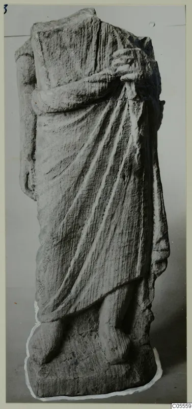 Stone statue of a draped standing figure from Soli, head and one arm missing