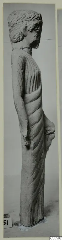Limestone statue of a standing figure from Mersinaki, seen in profile.