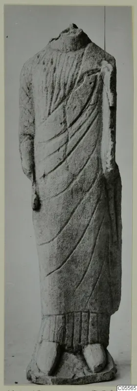 Headless limestone statue of a draped standing figure from Mersinaki, front view