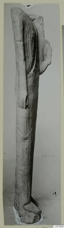 Limestone sculpture fragment of a standing figure in drapery, from Mersinaki