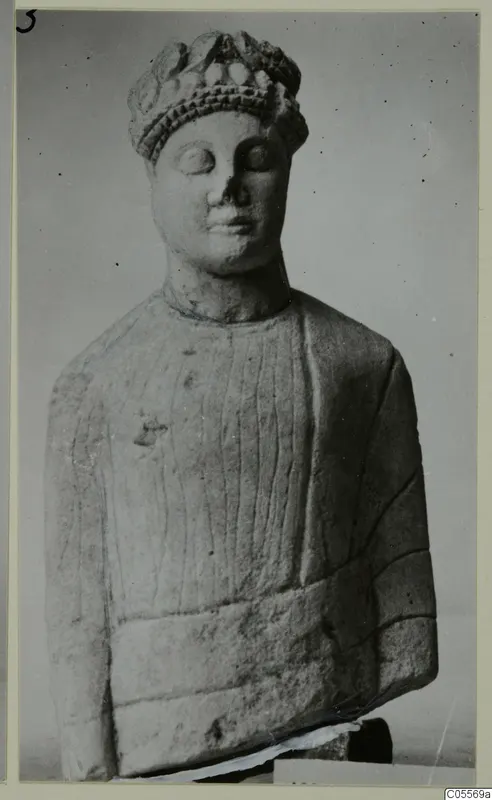 Carved limestone bust of a figure wearing a rounded headdress, from Mersinaki