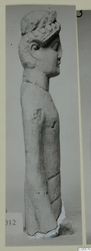 Limestone statue of a standing figure in profile, wearing a wreath, from Mersinaki
