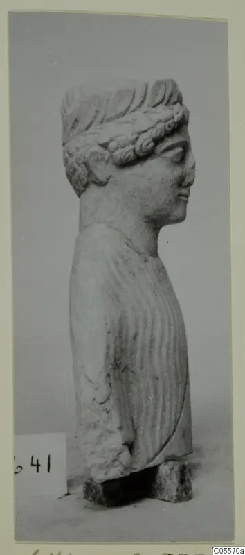 Limestone statue from Mersinaki, head and upper body shown in profile facing right, on a stone base