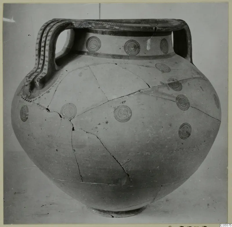 Black-on-Red amphora from Marion with concentric circle motifs and two strap handles, seen from the front.
