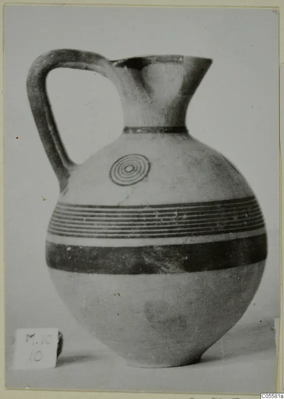 Black-on-Red jug from Marion, with dark painted bands and a concentric-circle motif on the shoulder