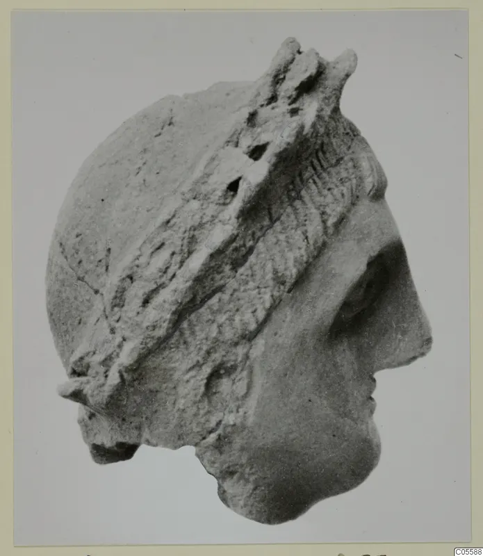 Stone head in right-facing profile with a raised band across the hair, from Mersinaki