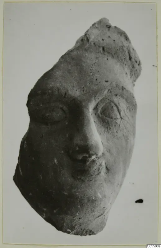 Terracotta head fragment with large eyes, nose and mouth, from Mersinaki