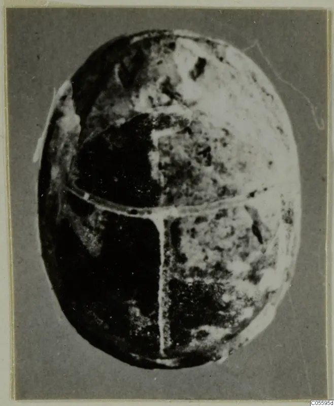 Stone scarab seen from above, its back divided by a cross-shaped line