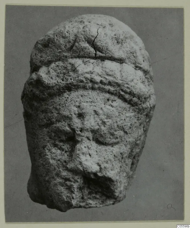 Limestone head from Mersinaki with a raised band across the brow and a broken nose