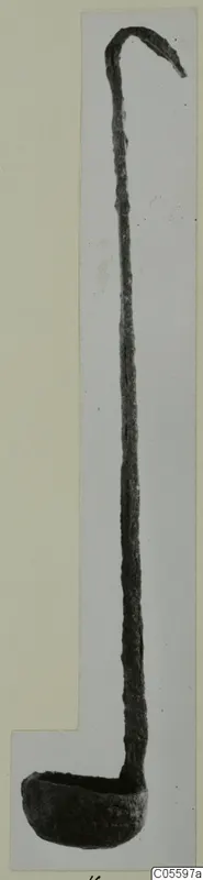 Bronze ladle from Marion, with a long slender handle, a hooked end and a shallow bowl.
