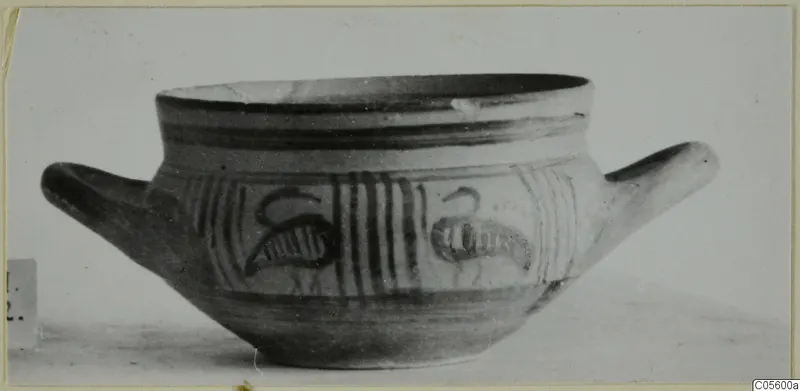 Two-handled bowl from Amathus with dark painted bands and hooked motifs on its side