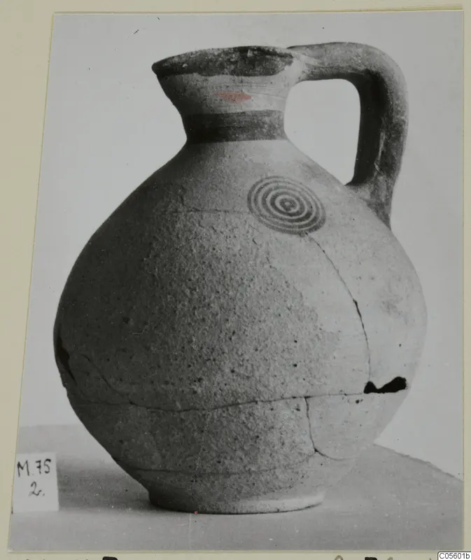 Pottery jug from Marion with a loop handle and concentric circles painted on the shoulder