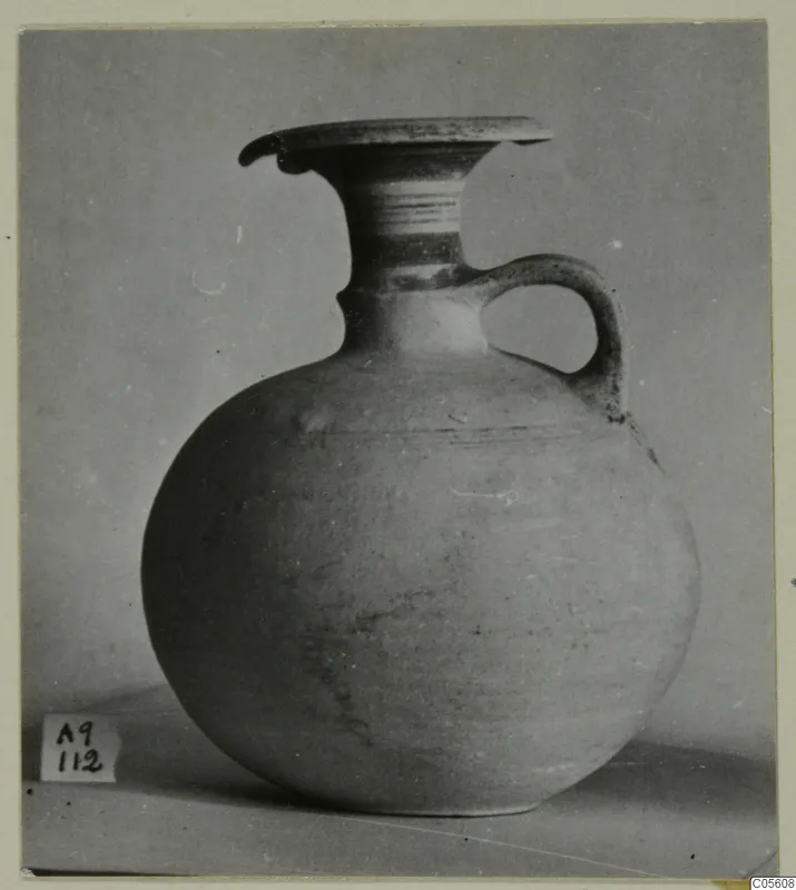 Jug of Pottery Polychrome III-VII from Amathus, tombs 1–9 series, with a flaring neck and single strap handle