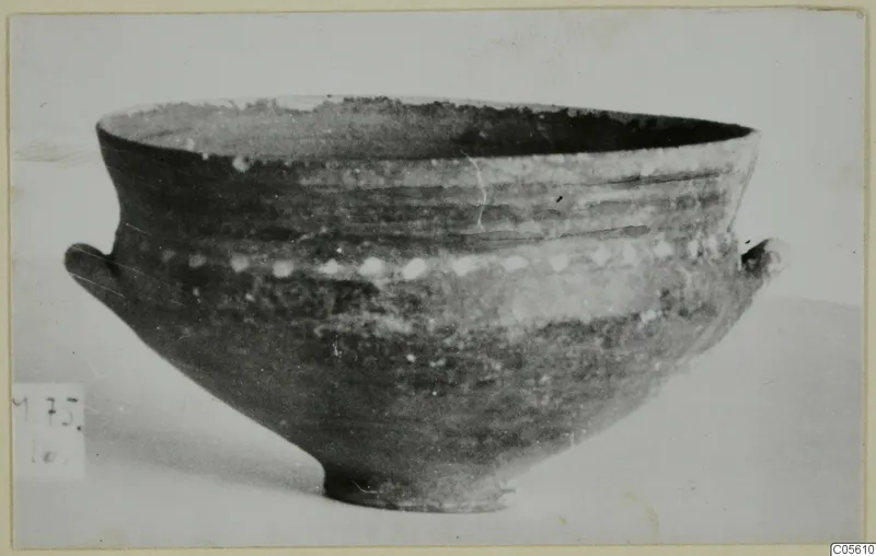 Bichrome-Red bowl with two small lug handles and a row of pale dots around its body